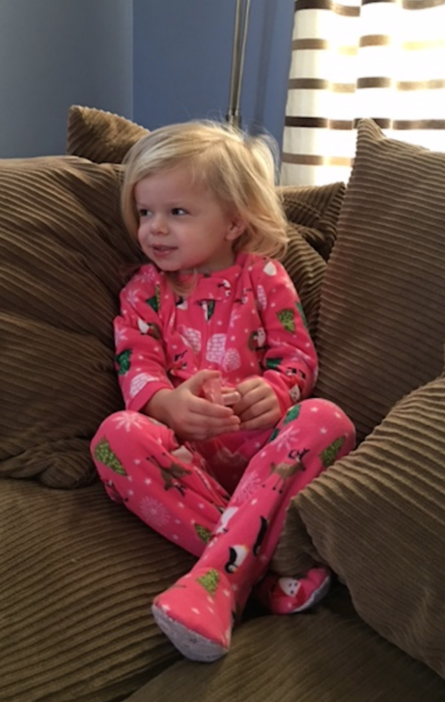 little girl in carters christmas pajamas