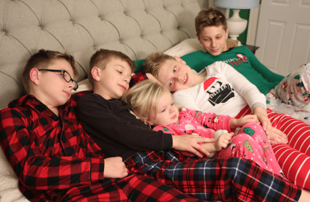 four boys and a girl in carters christmas pajamas