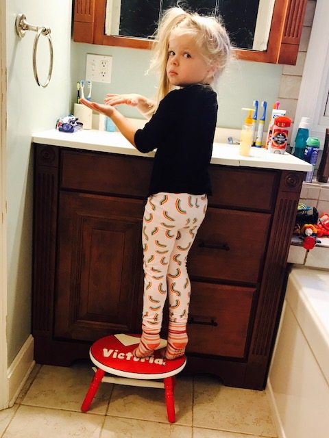 She looks so grown up stepping up to the sink on her own. 