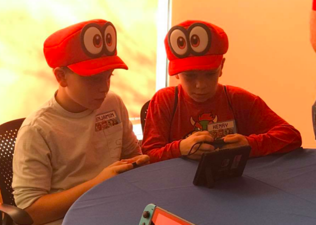 The boys even got fun hats at Nintendo Headquarters. 