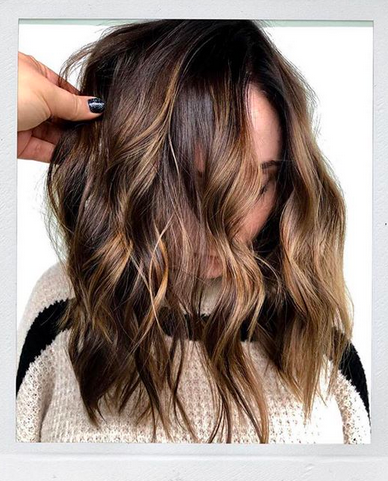 Who doesn't love a good dose of chocolate during the holidays and...all the time? Loving this shiny, chocolate and #bronde balayage, haircut and fabulous lived-in waves by Morganne