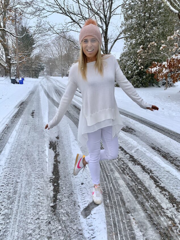 blonde woman wearing white in the winter