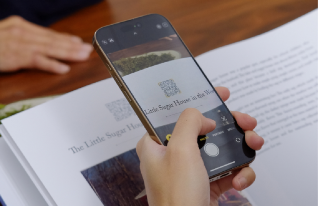 Iphone scanning a Remento book Qr Code